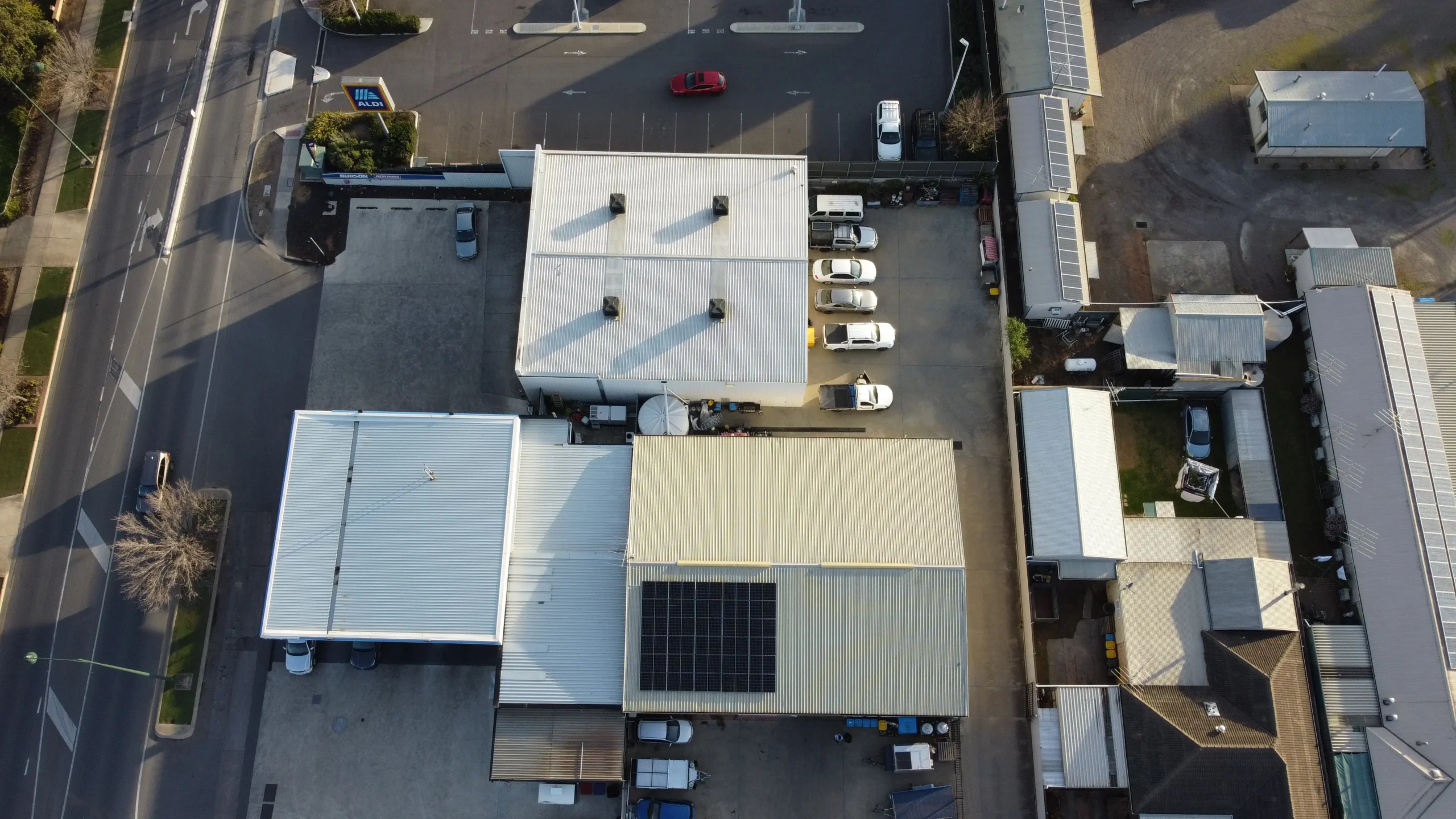 Large commercial rooftop covered with solar panels