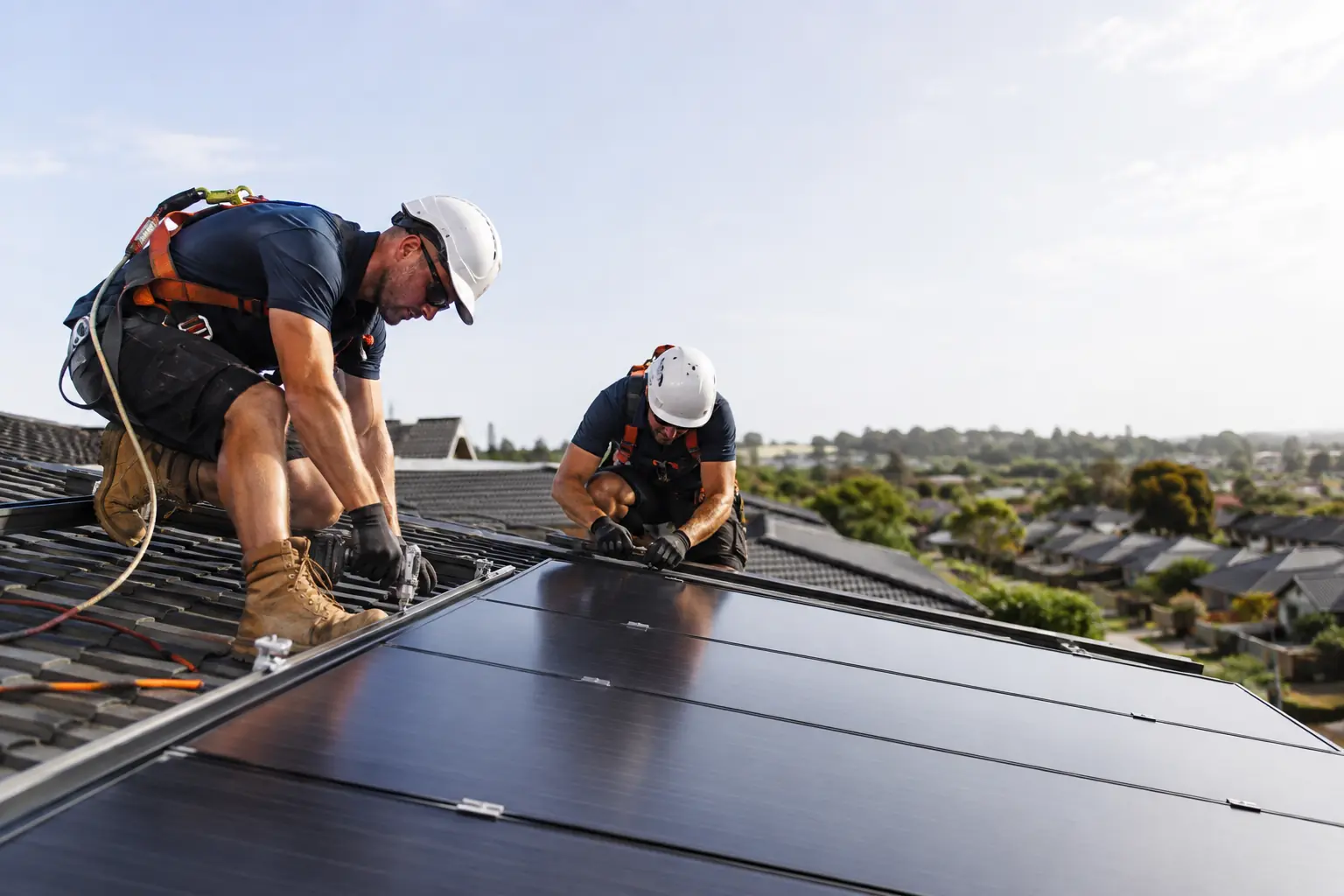 Solar installers working on a complete energy system